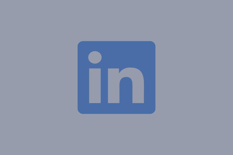 The LinkedIn logo fading against a dark background